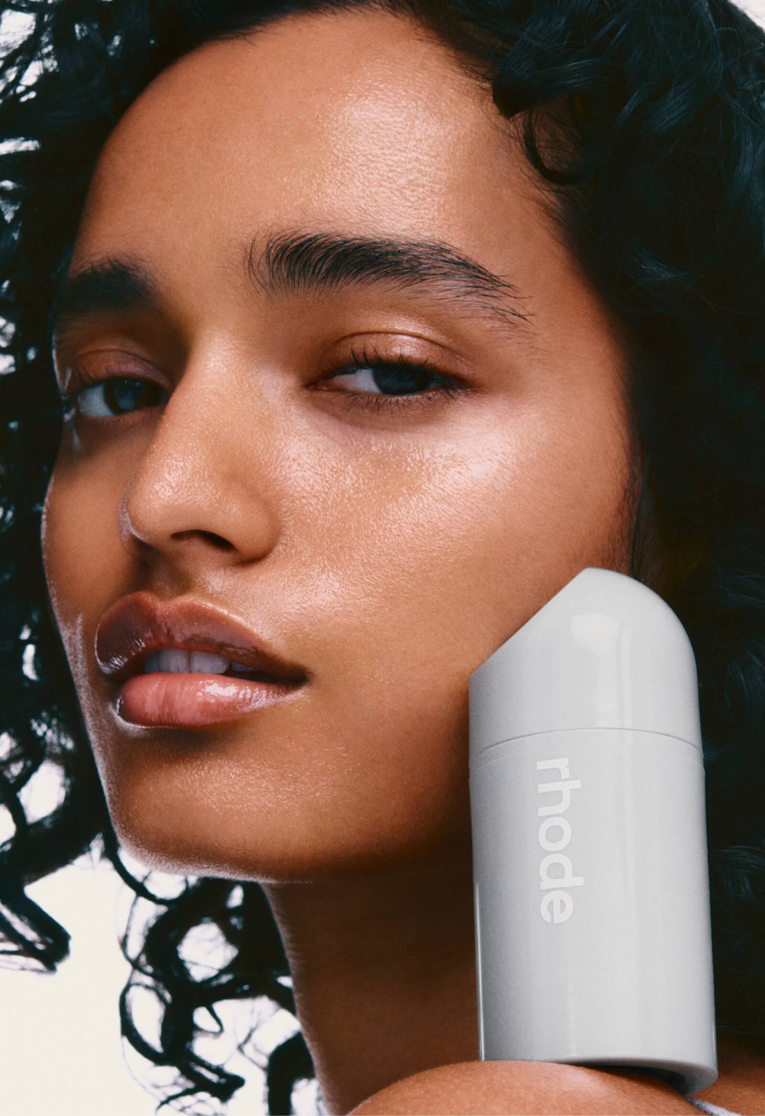 rhode Peptide Lip Treatment tube in-hand